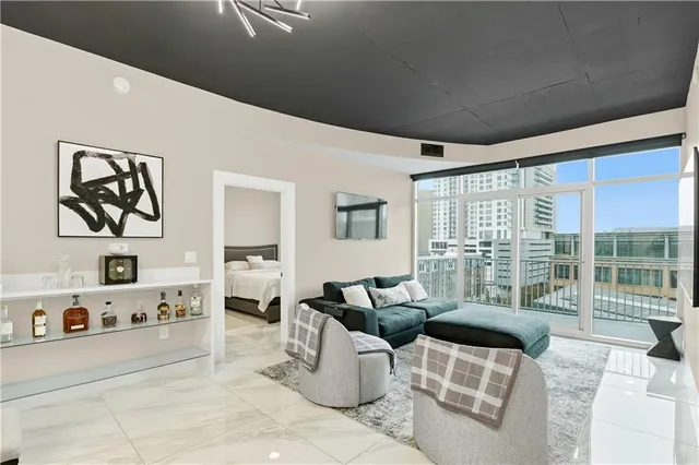 a living room with furniture and a large window