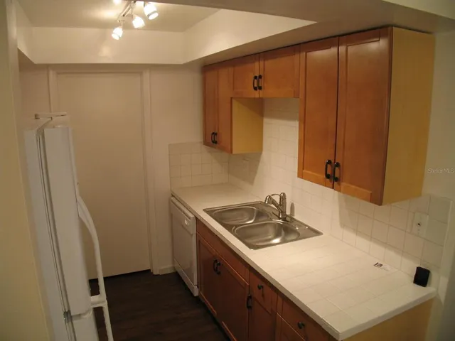a bathroom with a sink a vanity and a mirror
