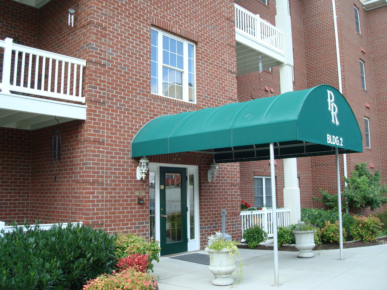 4438 Pheasant Ridge Road, Unit 208 Roanoke, VA 24014 - Photo 2 of 24 a front view of a house with a garden