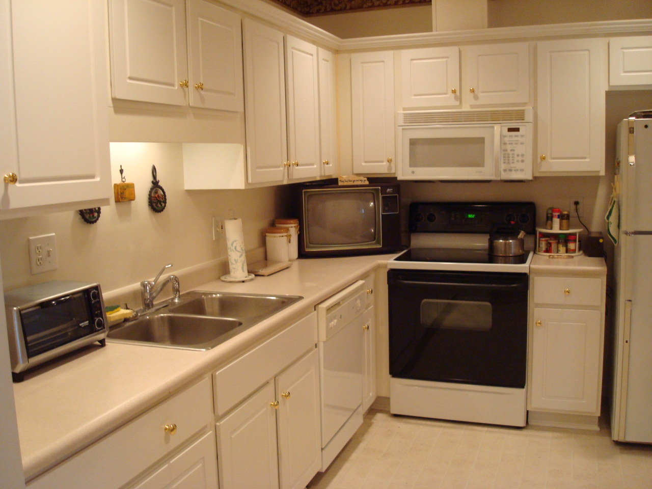 4438 Pheasant Ridge Road, Unit 208 Roanoke, VA 24014 - Photo 3 of 24 a kitchen with white cabinets and white appliances