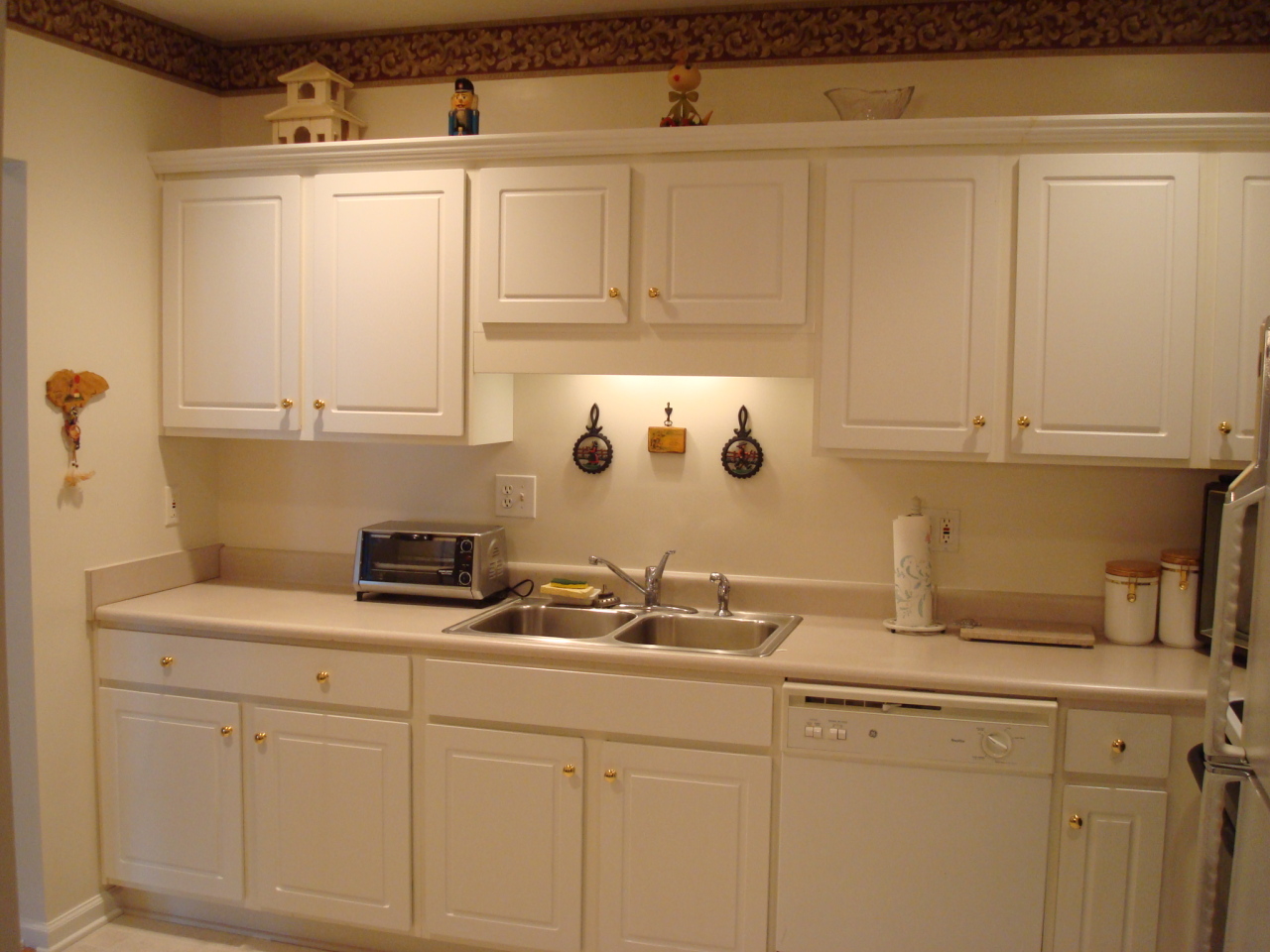 4438 Pheasant Ridge Road, Unit 208 Roanoke, VA 24014 - Photo 6 of 24 a kitchen with white cabinets and sink