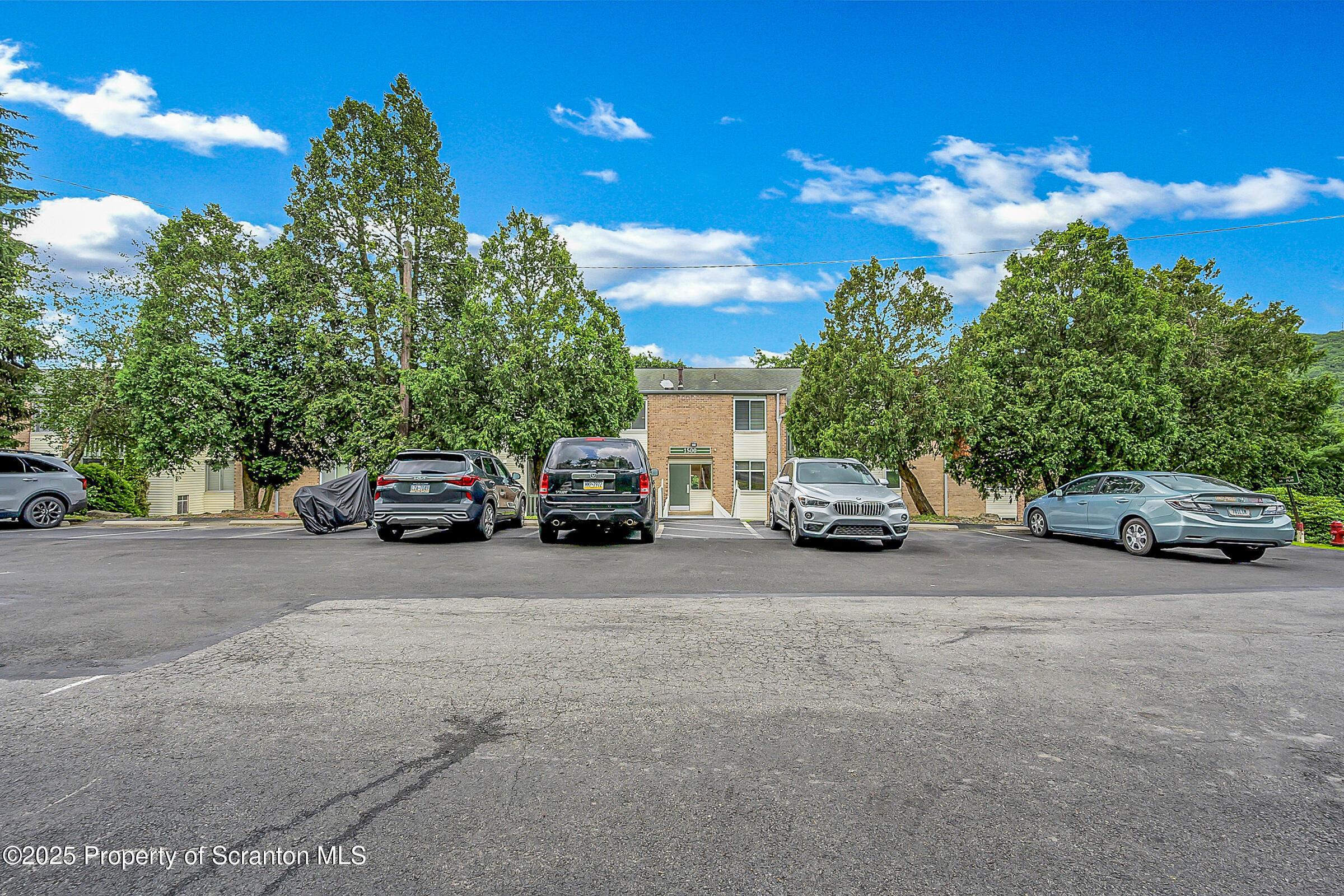1504 Summit Pointe, Unit 1504 Scranton, PA 18508 - Photo 22 of 22 a view of street with parked cars