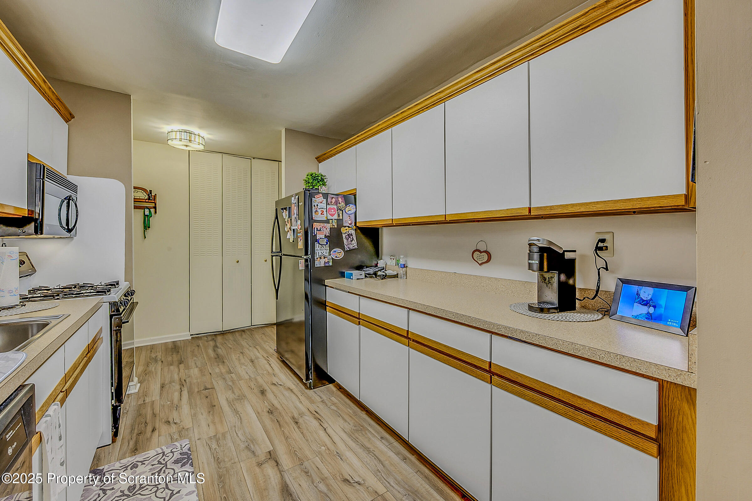 1504 Summit Pointe, Unit 1504 Scranton, PA 18508 - Photo 5 of 22 a kitchen with stainless steel appliances granite countertop a sink stove and refrigerator