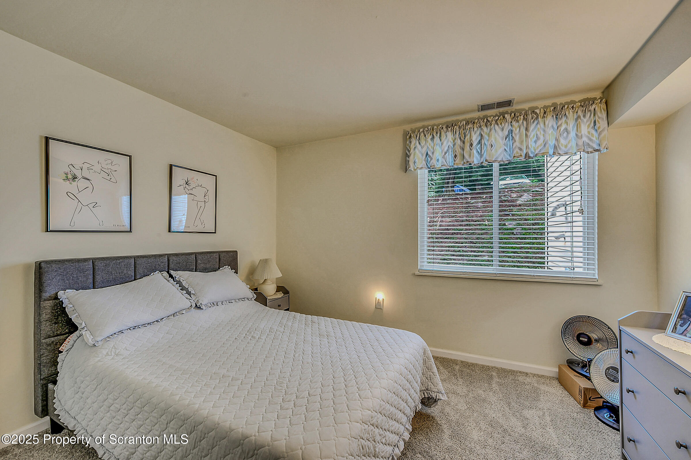 1504 Summit Pointe, Unit 1504 Scranton, PA 18508 - Photo 10 of 22 a bedroom with a bed and a window