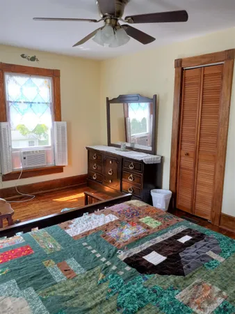 a living room with fireplace furniture and a window