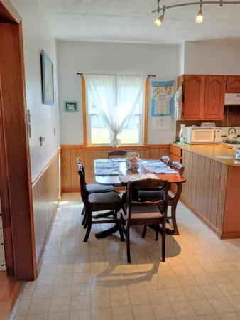 a view of a dining room with furniture