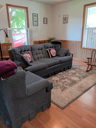 a living room with furniture and a window