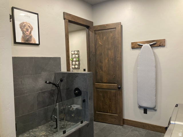 259 Meadow Drive Springville, UT 84663 - Photo 28 of 62 Bathroom featuring baseboards and dark tile patterned floors
