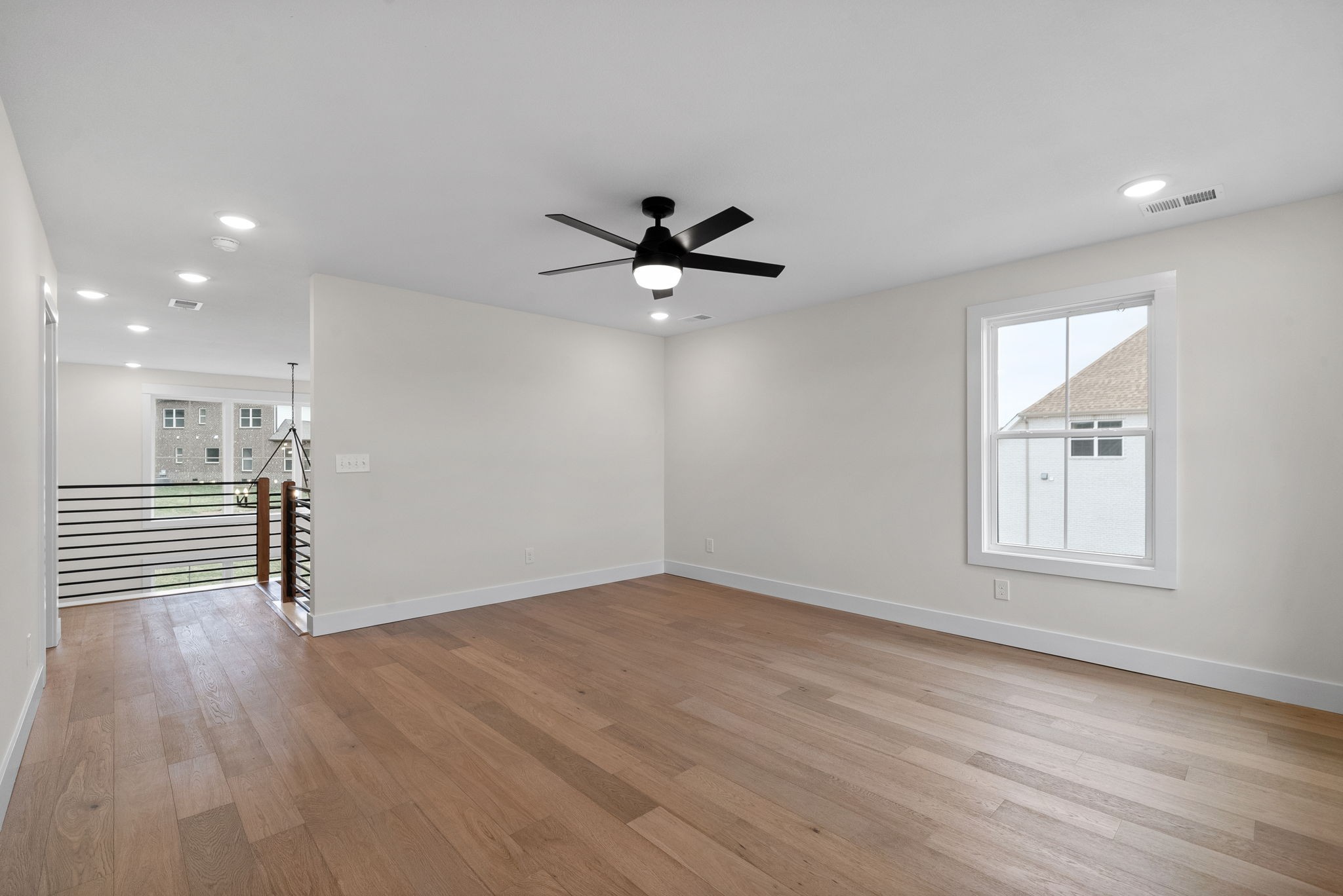 15 Rustling Oaks Court Pleasant View, TN 37146 - Photo 24 of 50 wooden floor in an empty room with a window