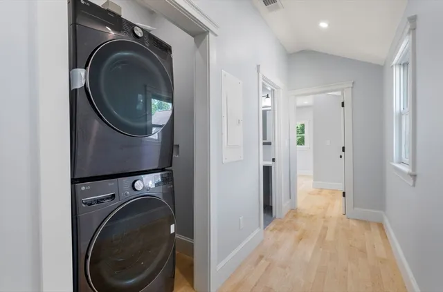 a view of a hallway with washer and dryer