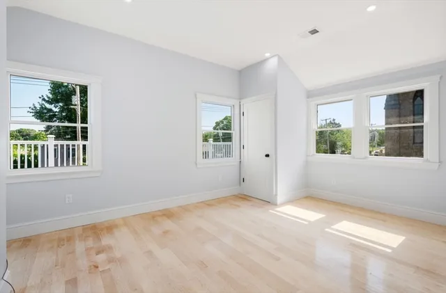 a view of an empty room with a window