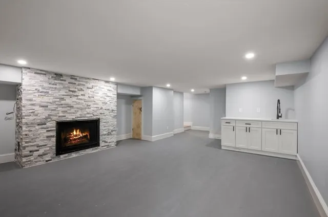 a view of an empty room with a fireplace