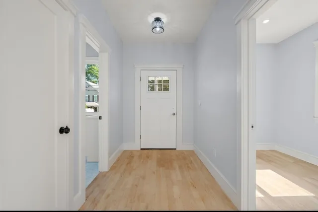 wooden floor in a hall with an entryway