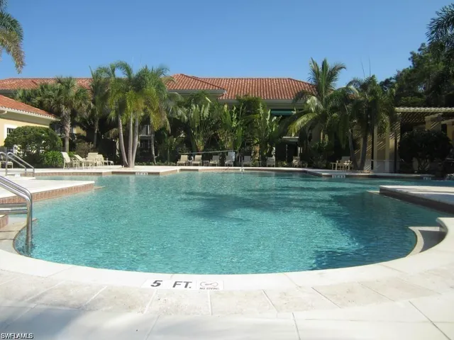 a view of a swimming pool with a garden