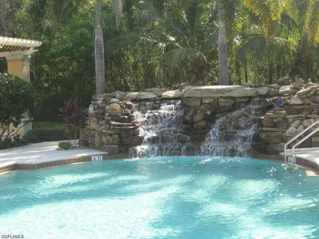 a living room with furniture gym equipment and view of living room