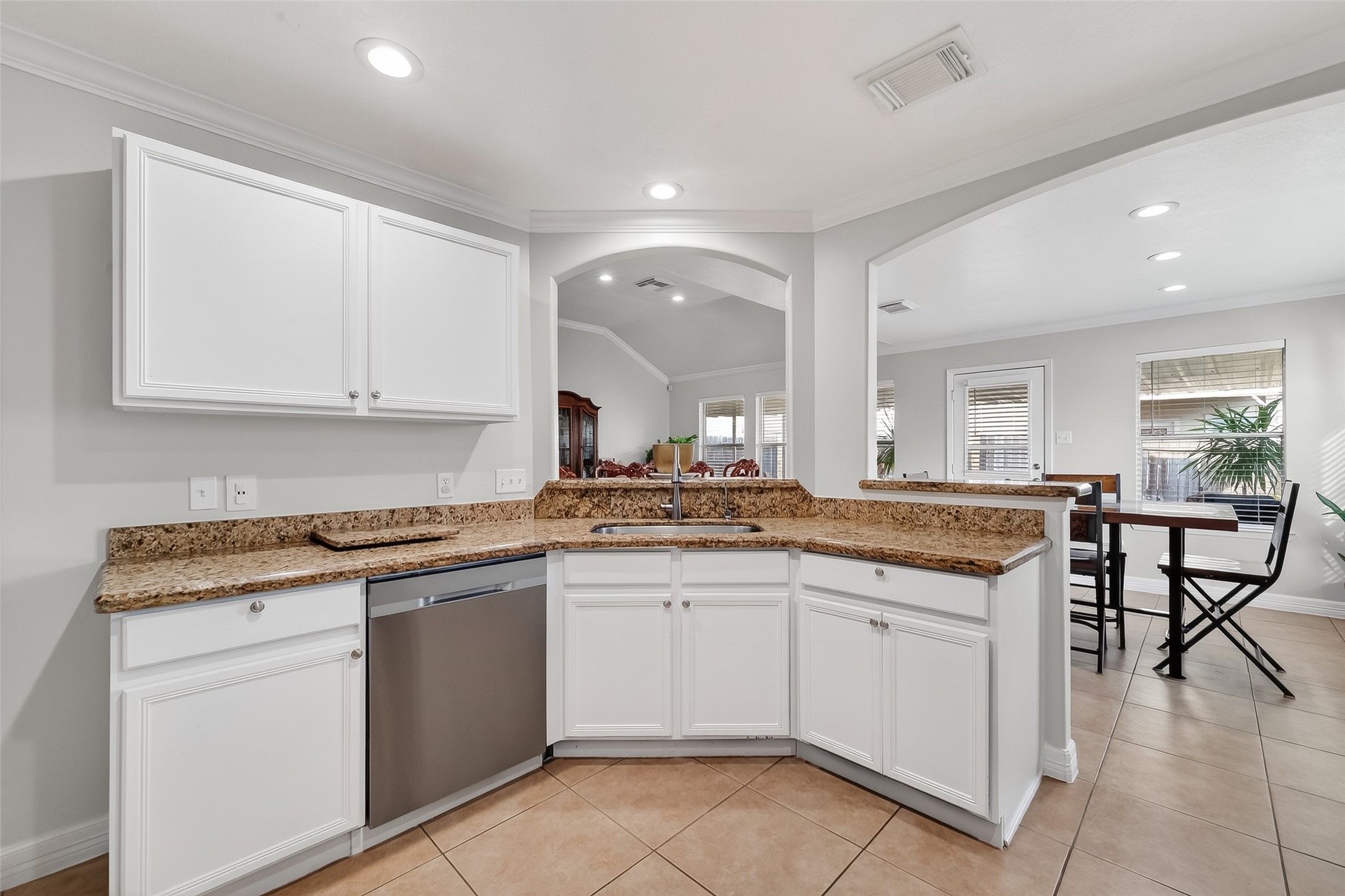 5902 Camron Point Circle Katy, TX 77449 - Photo 11 of 44 Bright kitchen featuring ample counter space, modern cabinetry, and open sightlines.