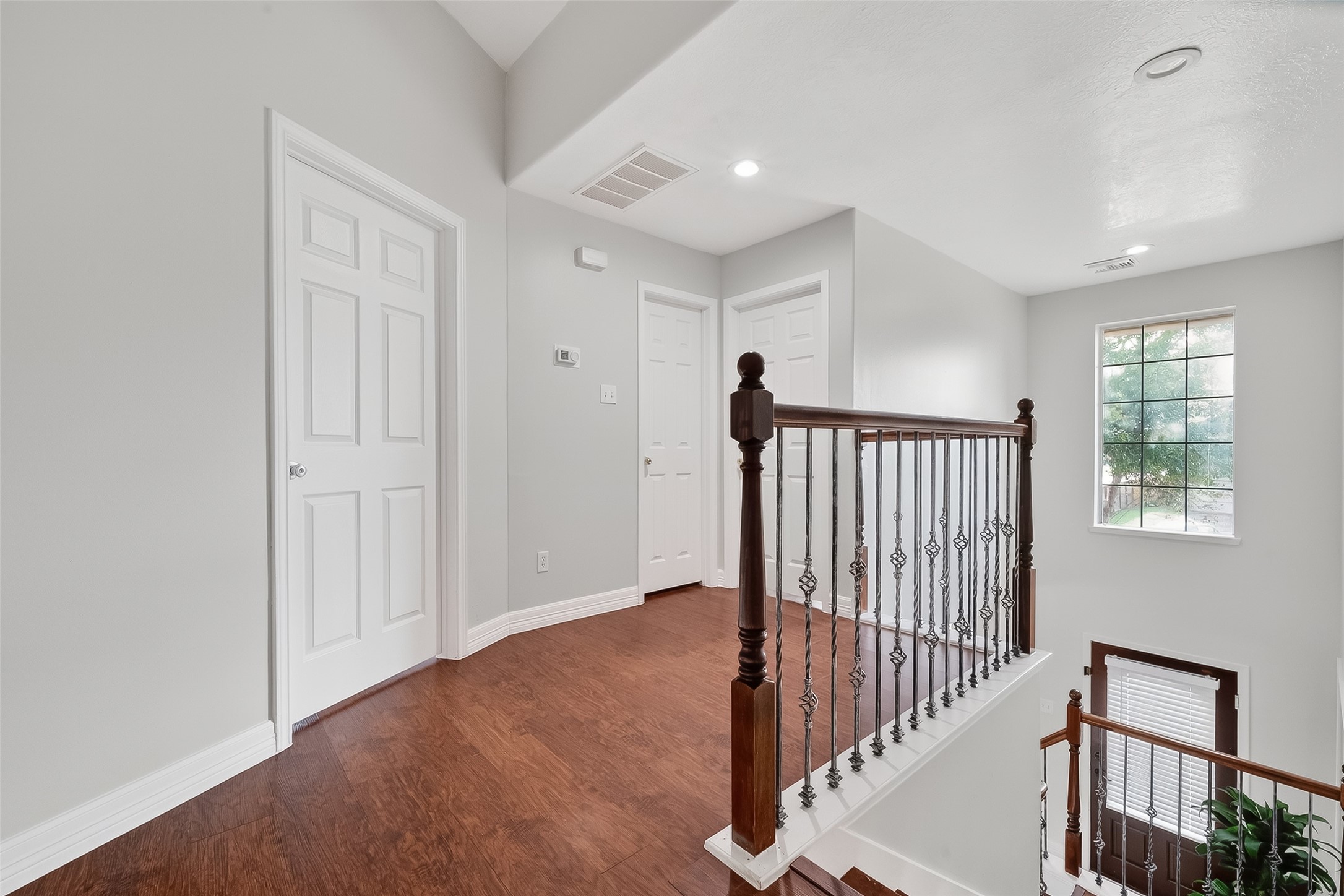 5902 Camron Point Circle Katy, TX 77449 - Photo 22 of 44 Open second-level landing with hardwood flooring and overlook to the foyer.