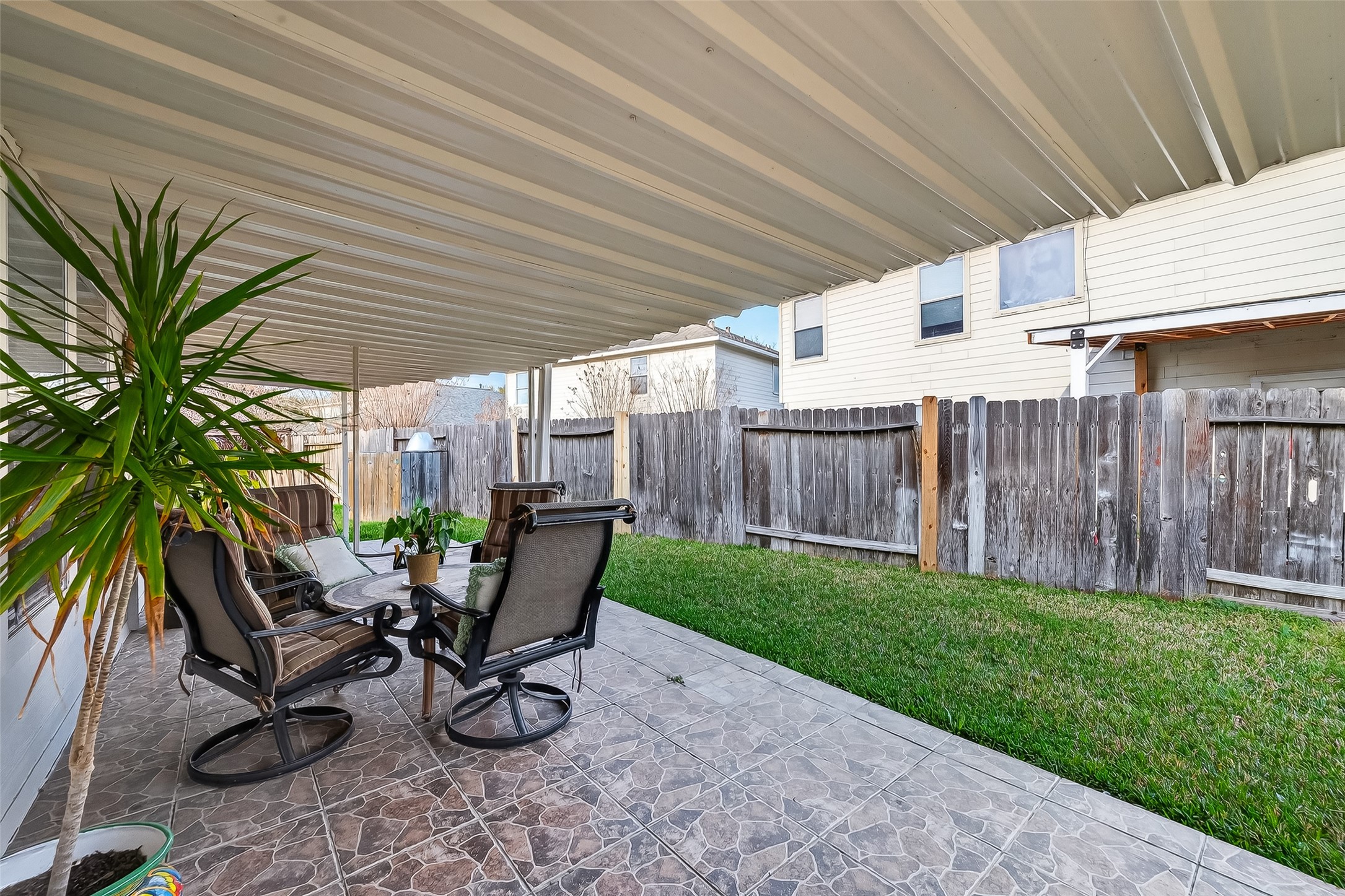 5902 Camron Point Circle Katy, TX 77449 - Photo 36 of 44 Covered patio overlooking private backyard, ideal for outdoor dining and relaxation.