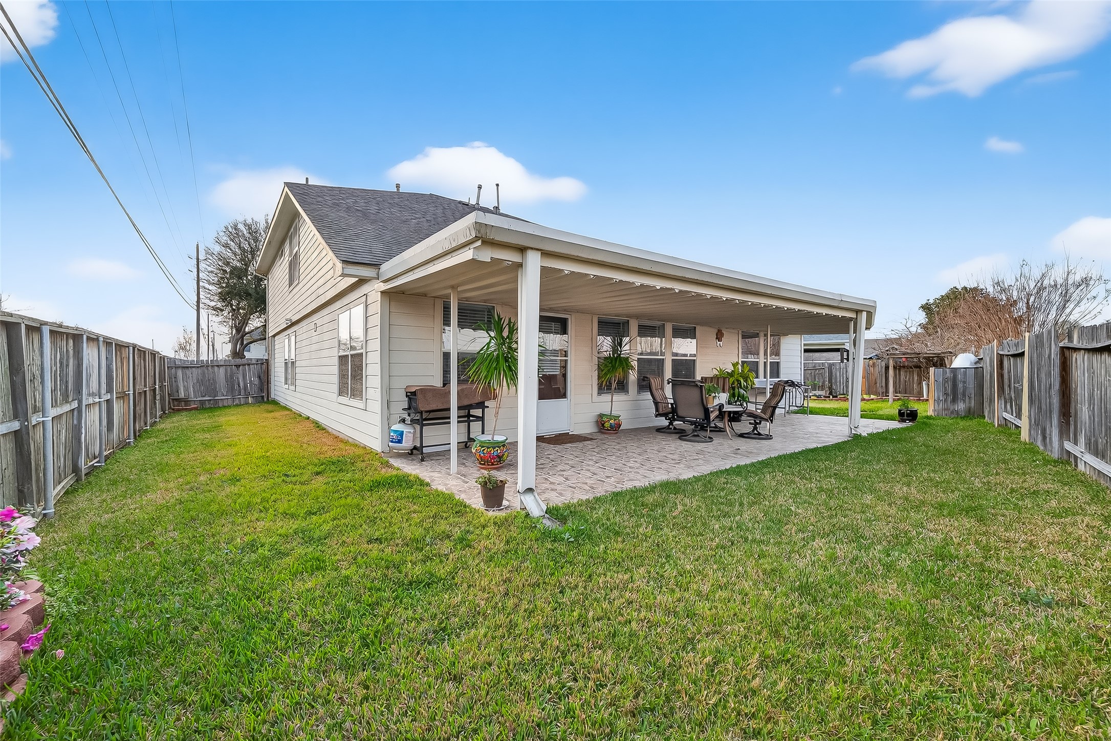 5902 Camron Point Circle Katy, TX 77449 - Photo 38 of 44 Spacious backyard featuring covered patio and open green lawn.