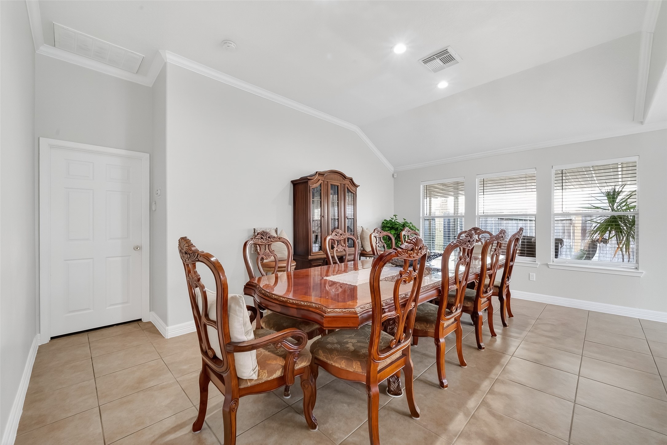 5902 Camron Point Circle Katy, TX 77449 - Photo 7 of 44 Elegant dining area with crown molding, chandelier lighting, and ample space for gatherings.