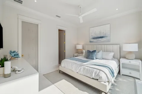 a bedroom with a bed and a mirror