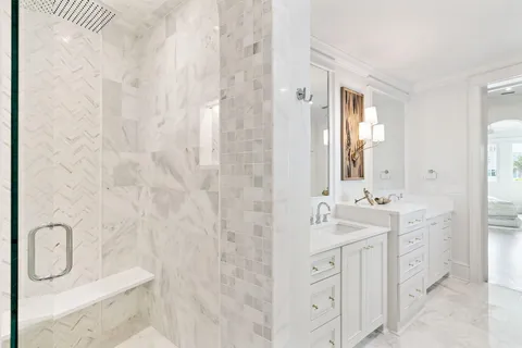 a spacious bathroom with double sink and mirror