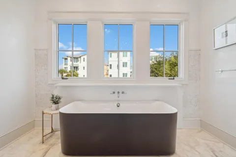a bathroom with a sink and a window