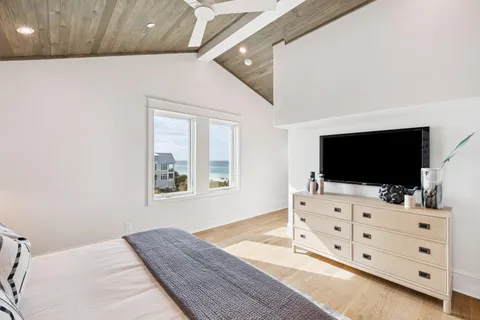 a living room with furniture and flat screen tv