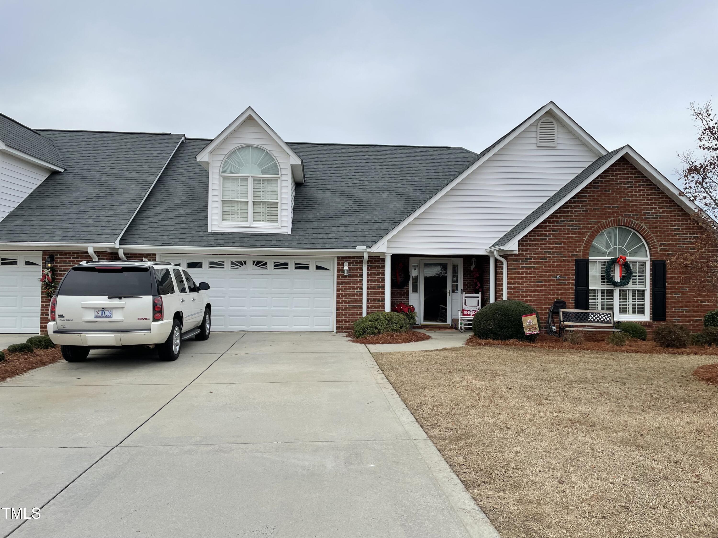 a view of a car park in front of house
