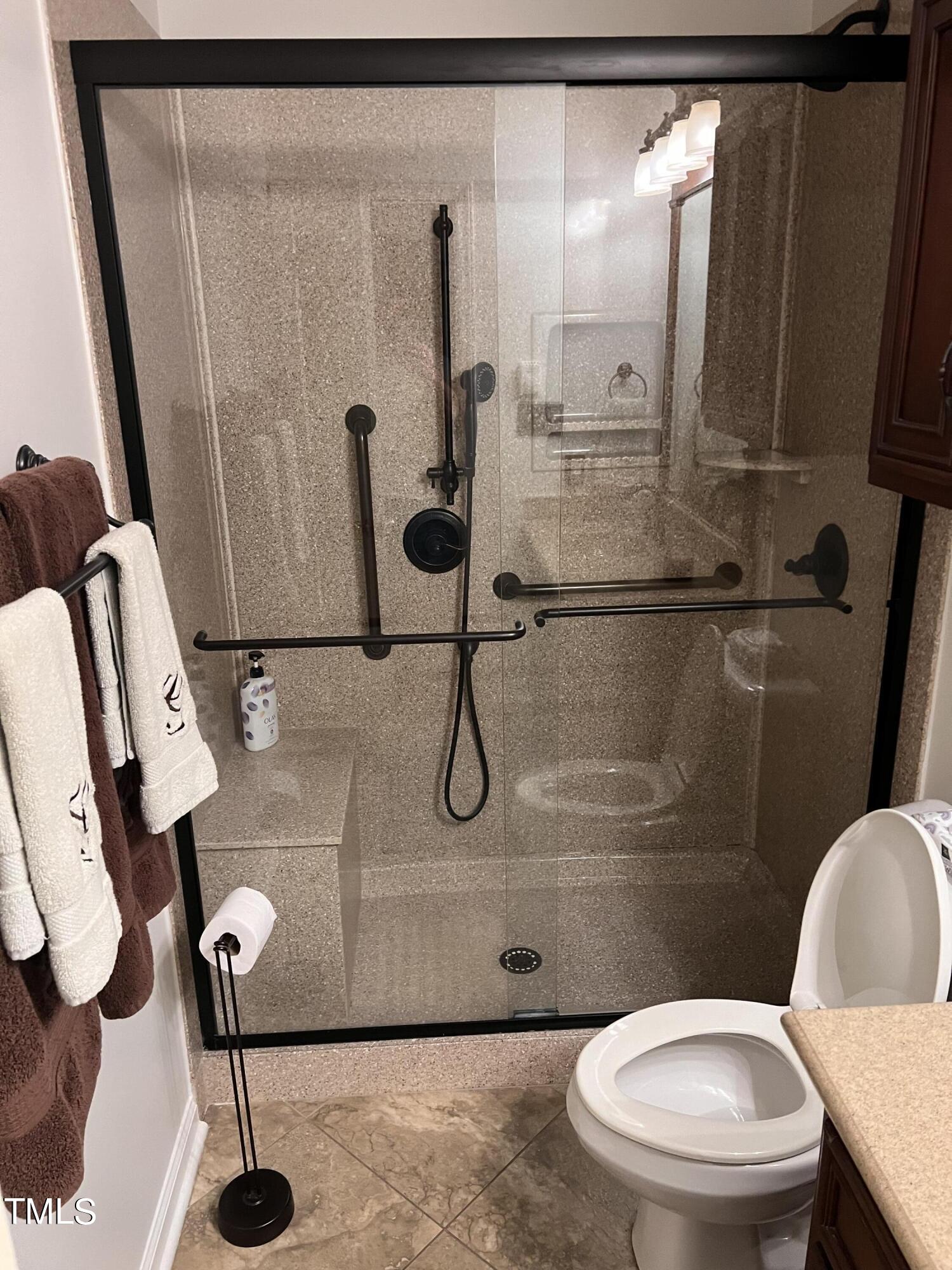 104 Chadbury Drive Dunn, NC 28334 - Photo 14 of 23 a bathroom with a toilet and a shower