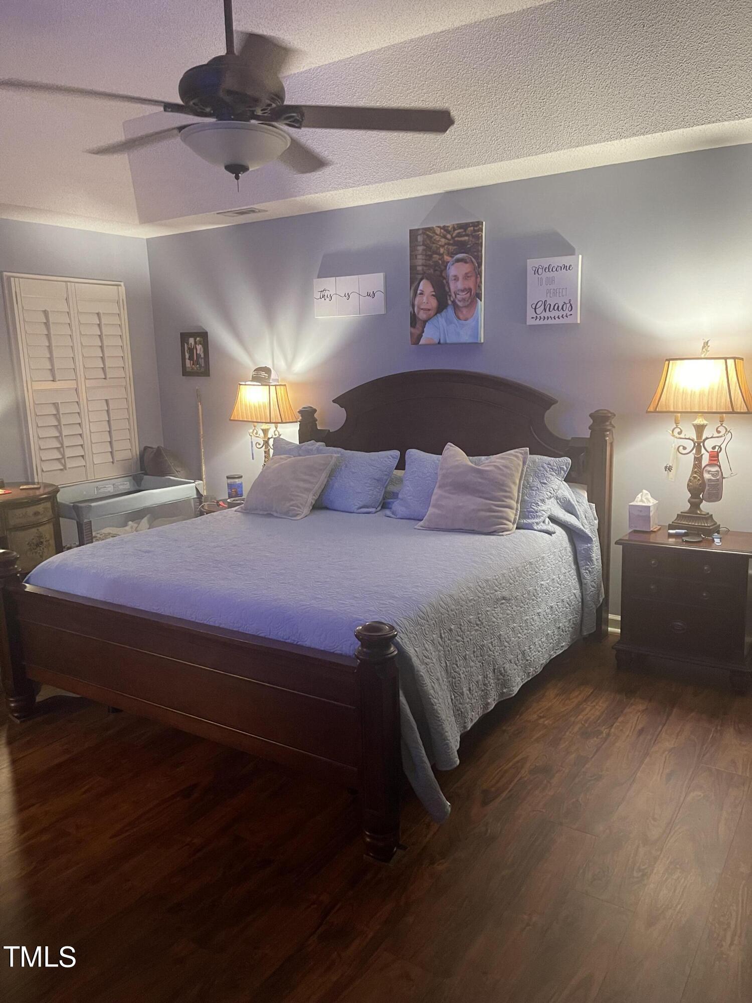 104 Chadbury Drive Dunn, NC 28334 - Photo 15 of 23 a bedroom with a bed and a lamp