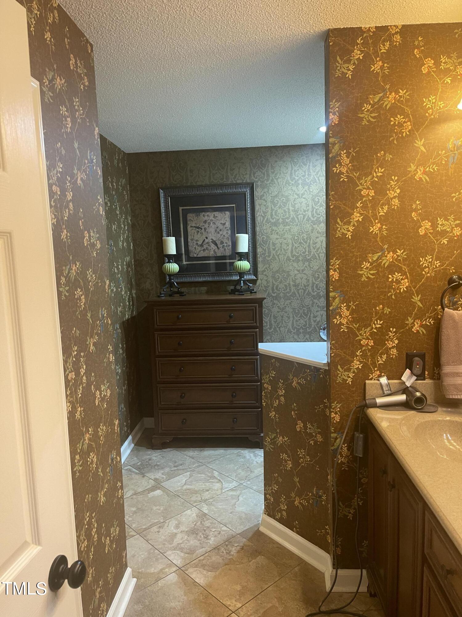 104 Chadbury Drive Dunn, NC 28334 - Photo 19 of 23 a bathroom with a sink and a mirror