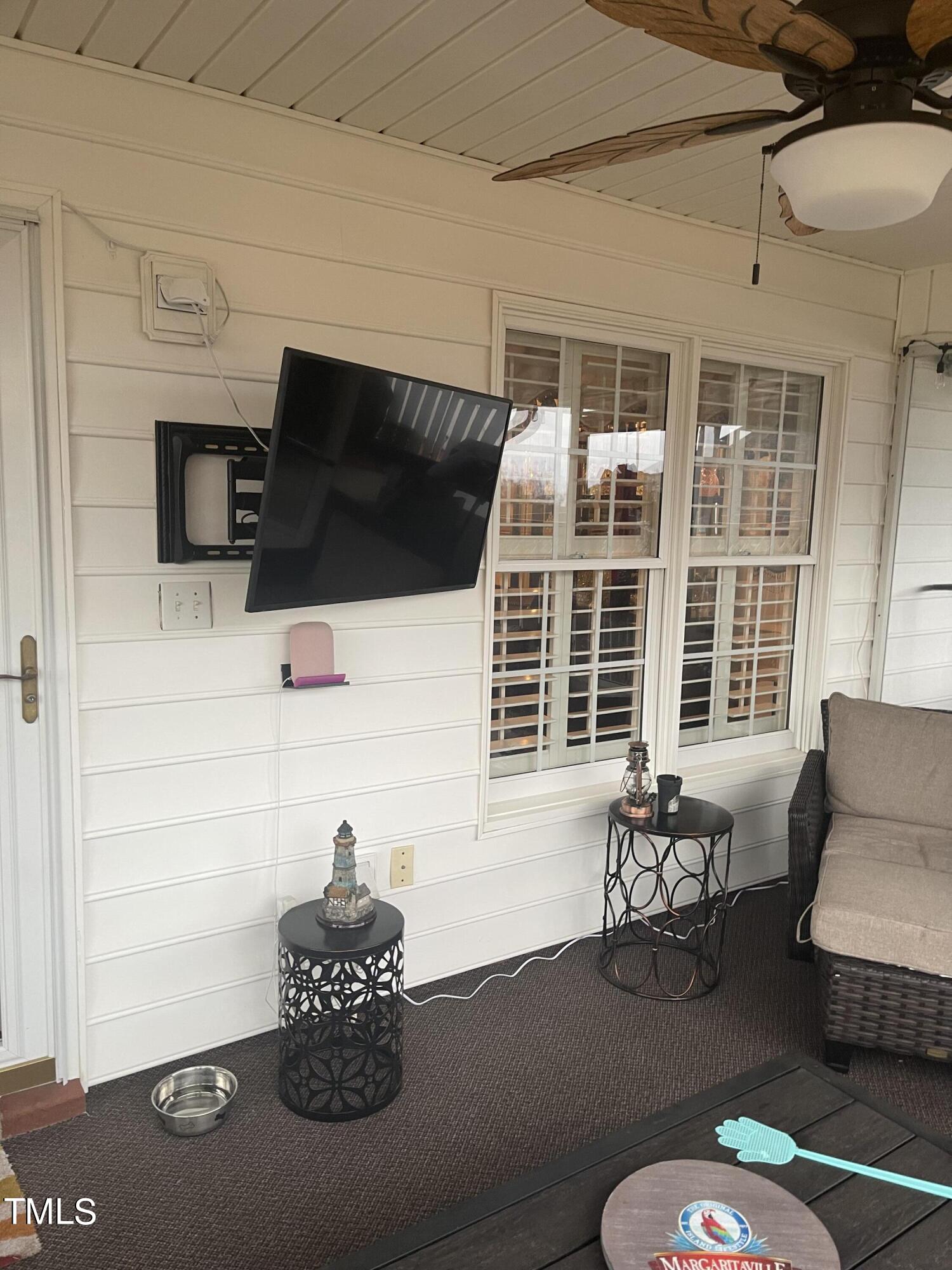 104 Chadbury Drive Dunn, NC 28334 - Photo 22 of 23 a living room with furniture and a flat screen tv