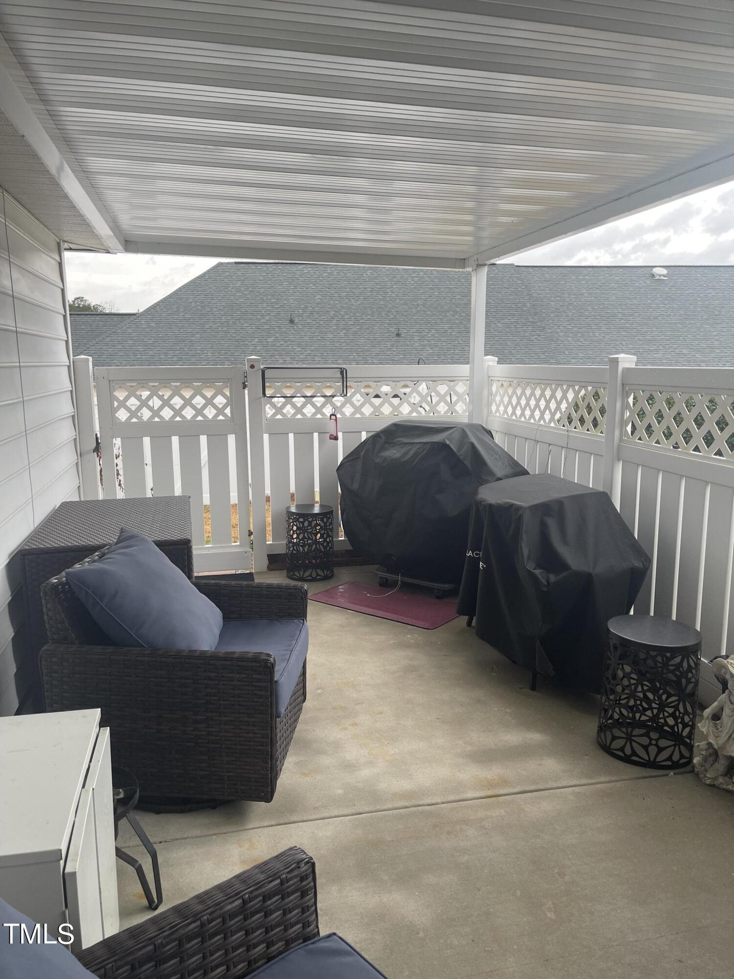 104 Chadbury Drive Dunn, NC 28334 - Photo 23 of 23 a living room with furniture and a rug