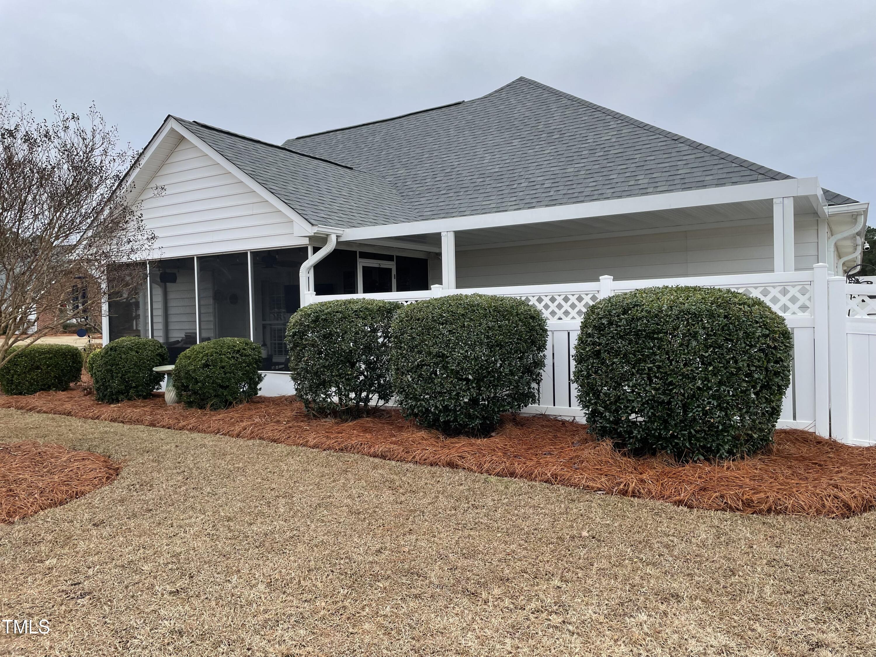 104 Chadbury Drive Dunn, NC 28334 - Photo 3 of 23 front view of a house with potted plants