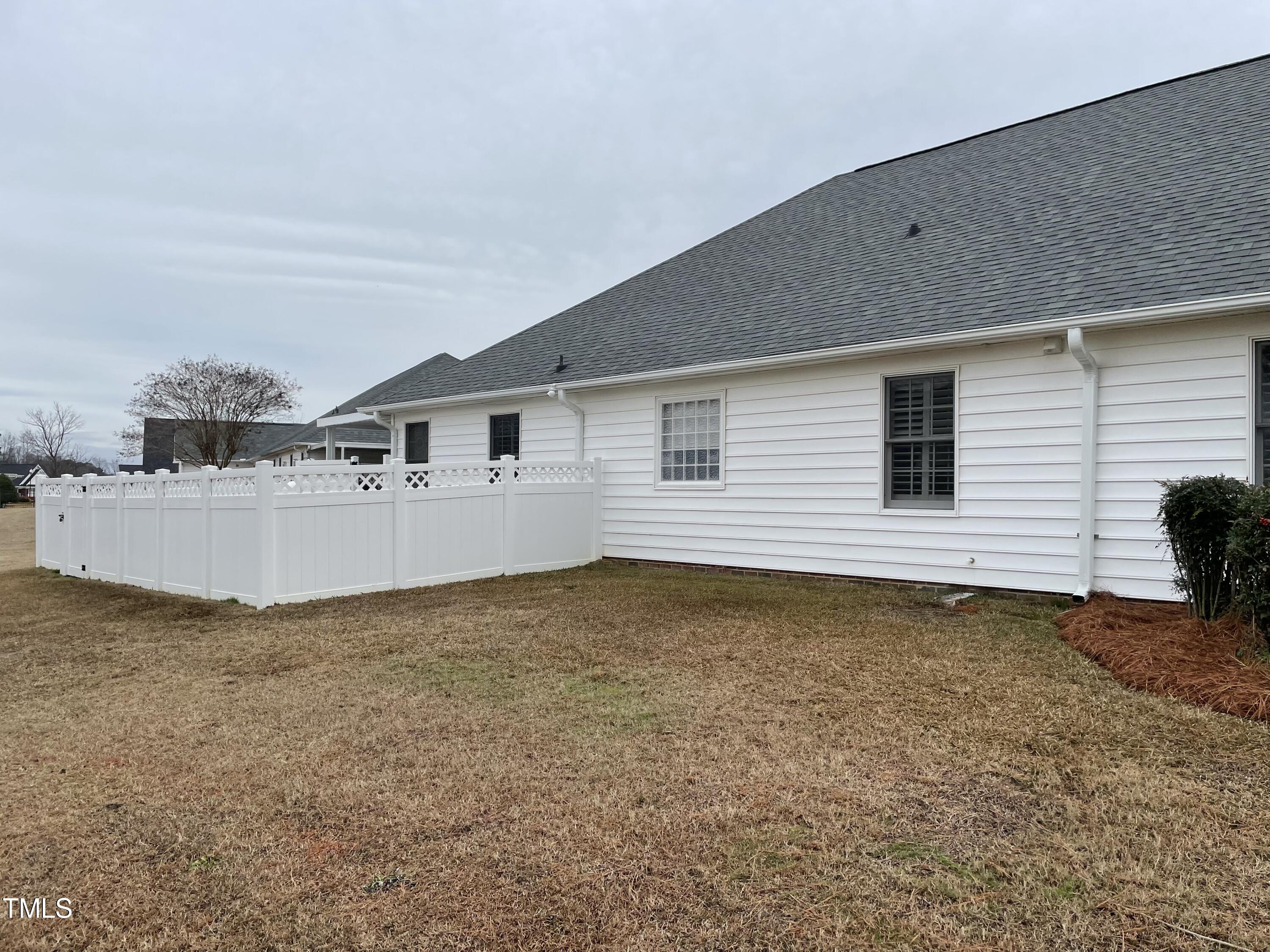 104 Chadbury Drive Dunn, NC 28334 - Photo 4 of 23 a view of a house with backyard and wooden fence