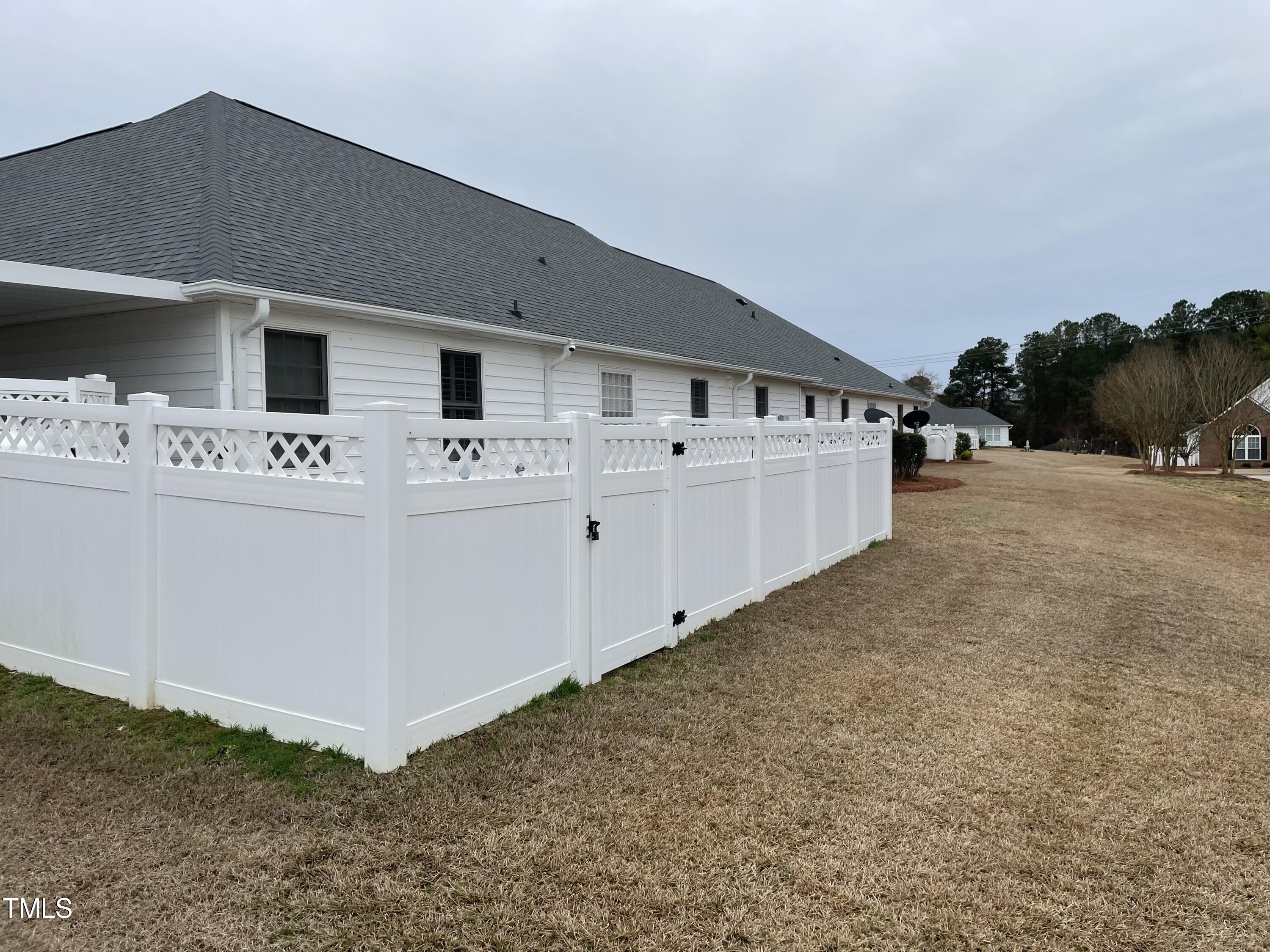 104 Chadbury Drive Dunn, NC 28334 - Photo 5 of 23 a view of kitchen with utility room and wooden floor