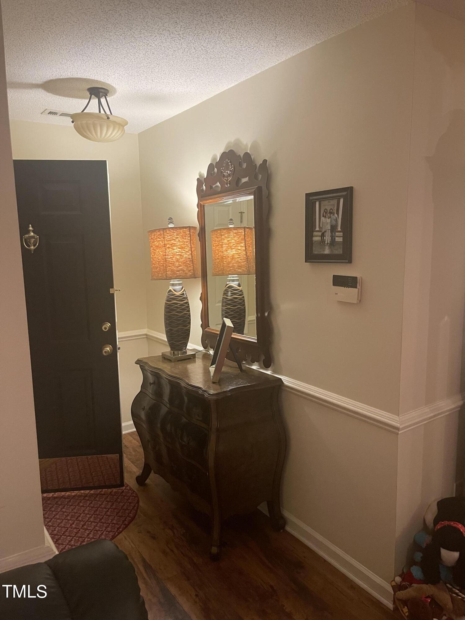 104 Chadbury Drive Dunn, NC 28334 - Photo 6 of 23 a workspace with furniture and mirror