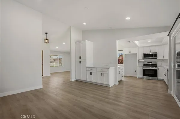 a view of kitchen with wooden floor