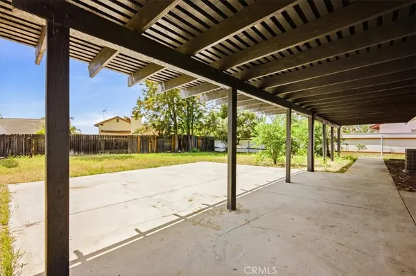 a view of an empty room with a balcony