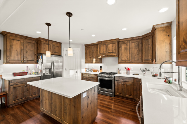 1145 North Christley Lane, Unit 48 Elk Ridge, UT 84651 - Photo 3 of 38 Kitchen featuring wood-finish flooring, custom wood cabinetry, and white countertops