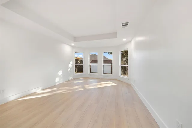 a view of a livingroom with wooden floor