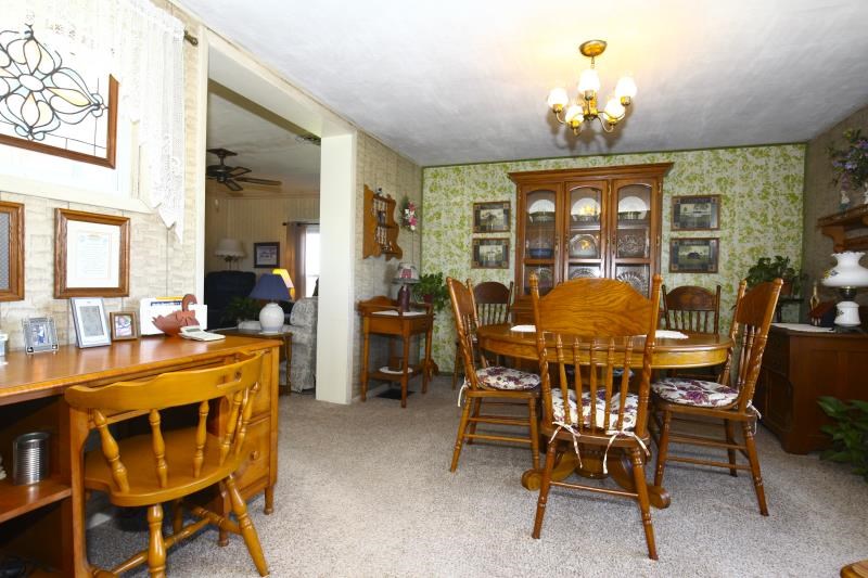3968 Hunter Road Poplar Grove, IL 61065 - Photo 12 of 25 a view of a dining room with furniture and chandelier