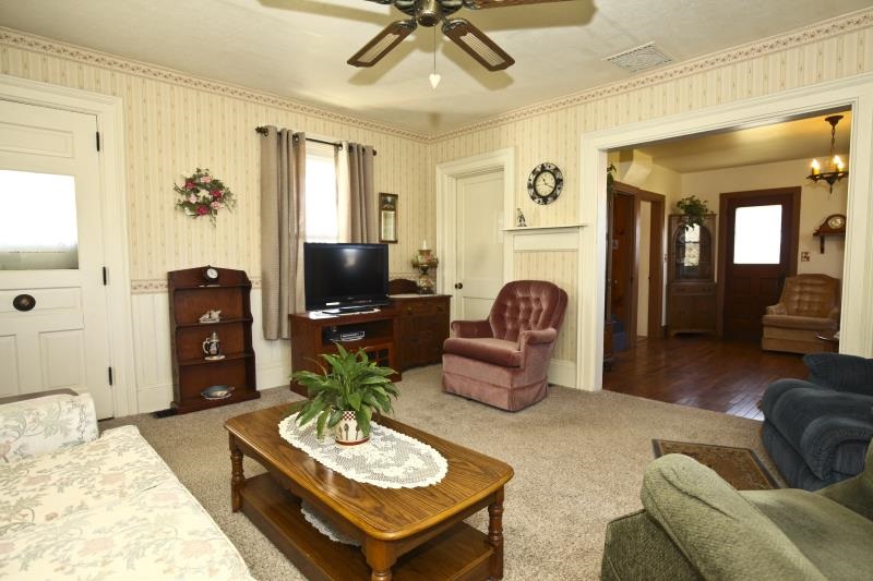 3968 Hunter Road Poplar Grove, IL 61065 - Photo 15 of 25 a living room with furniture and a flat screen tv