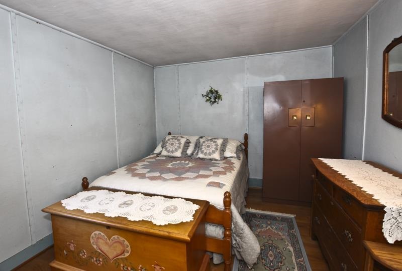 3968 Hunter Road Poplar Grove, IL 61065 - Photo 16 of 25 a bedroom with a bed and a table in it