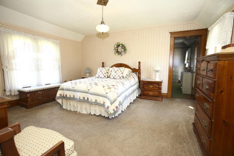 3968 Hunter Road Poplar Grove, IL 61065 - Photo 21 of 25 a bedroom with a bed and a couch