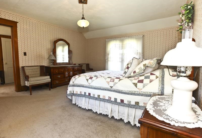 3968 Hunter Road Poplar Grove, IL 61065 - Photo 23 of 25 a bedroom with bed and window