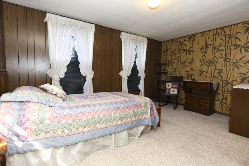 3968 Hunter Road Poplar Grove, IL 61065 - Photo 25 of 25 a bedroom with a bed and dresser with mirror