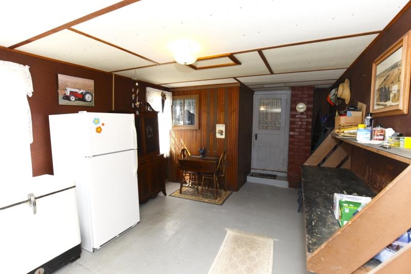 3968 Hunter Road Poplar Grove, IL 61065 - Photo 9 of 25 a view of hallway with furniture and a refrigerator