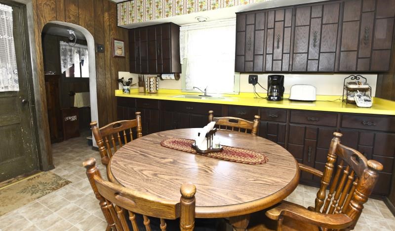 3968 Hunter Road Poplar Grove, IL 61065 - Photo 10 of 25 a kitchen with dining table and chairs